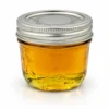 Wholesale D9 jar with silver lid, filled with golden amber D9 oil
